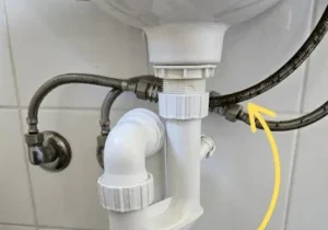 Braided flexi pressure pipe under a sink - Coast Runner Plumbing and Gas Perth